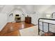 Bright bedroom featuring hardwood floors, vaulted ceilings, and ample natural light at 1219 Pinecrest Ave, Charlotte, NC 28205