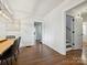 Elegant dining room with hardwood floors, wainscoting, and a modern chandelier at 1219 Pinecrest Ave, Charlotte, NC 28205