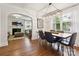 Open dining room shows transition to the living room, chandelier, and white trim at 1219 Pinecrest Ave, Charlotte, NC 28205