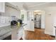 Open kitchen layout with stainless steel appliances and granite countertops at 1219 Pinecrest Ave, Charlotte, NC 28205