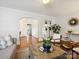 Open concept living room showing views into other parts of the home, white trim, and hardwood floors at 1219 Pinecrest Ave, Charlotte, NC 28205