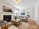 Inviting living room featuring a fireplace, neutral colors, and lots of natural light at 1219 Pinecrest Ave, Charlotte, NC 28205