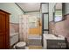 Cozy bathroom featuring a bathtub, shower, toilet, vanity, and charming decor, creating a functional space at 123 N Poston St, Shelby, NC 28150