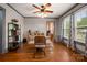 Bright dining room featuring hardwood floors, a modern ceiling fan, and stylish decor at 123 N Poston St, Shelby, NC 28150