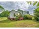 Charming home exterior with green grass, blooming bushes, and a well-manicured yard, offering curb appeal at 123 N Poston St, Shelby, NC 28150