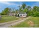 Residential property with a fenced yard and a gravel driveway at 123 N Poston St, Shelby, NC 28150