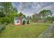 Single-story home featuring green lawn, chain-link fence and mature trees at 123 N Poston St, Shelby, NC 28150