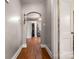 Inviting hallway with hardwood floors and an arched doorway that adds charm and character at 123 N Poston St, Shelby, NC 28150