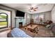 Living room with hardwood floors, brick fireplace, and a large window overlooking the yard at 123 N Poston St, Shelby, NC 28150