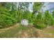 Well-maintained shed in a lush green yard, offering ample storage space for your tools and equipment at 123 N Poston St, Shelby, NC 28150