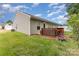 Backyard view of a cozy home with a wooden deck and a lush green lawn, perfect for outdoor enjoyment at 1405 Amberlight Cir, Salisbury, NC 28144