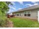 A spacious backyard with a well-maintained lawn and a wooden deck, ideal for outdoor enjoyment at 1405 Amberlight Cir, Salisbury, NC 28144