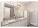Bright bathroom features double sinks with granite counters and white cabinets at 1405 Amberlight Cir, Salisbury, NC 28144