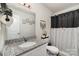 Bathroom with granite countertop, decorative wall art and black shower curtain at 1405 Amberlight Cir, Salisbury, NC 28144