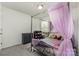 Bedroom featuring a four-poster bed with pink sheer curtains at 1405 Amberlight Cir, Salisbury, NC 28144
