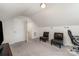 Carpeted bonus room features multiple seating options and an open layout at 1405 Amberlight Cir, Salisbury, NC 28144