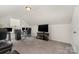 Carpeted bonus room featuring a desk area and media center setup at 1405 Amberlight Cir, Salisbury, NC 28144