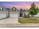 Charming townhome featuring a one-car garage, neat landscaping, and a freshly painted front facade at 1405 Amberlight Cir, Salisbury, NC 28144