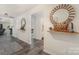 Hallway view to living room featuring gray couches, neutral walls, and modern flooring at 1405 Amberlight Cir, Salisbury, NC 28144