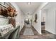Hallway view into living room featuring gray couches, neutral walls, and modern flooring at 1405 Amberlight Cir, Salisbury, NC 28144