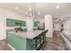 Bright kitchen with granite island, stainless steel appliances, pendant lighting, and stylish barstool seating at 1405 Amberlight Cir, Salisbury, NC 28144
