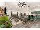 Open living room with modern furniture, stylish decor, and a seamless flow into the kitchen and dining area at 1405 Amberlight Cir, Salisbury, NC 28144
