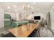 Open-concept living space featuring a modern kitchen with granite island, dining area, and a cozy living room at 1405 Amberlight Cir, Salisbury, NC 28144