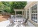 Relaxing backyard deck features a swing, rocking chairs, and a table, ideal for outdoor enjoyment at 14218 Springsure Ct, Huntersville, NC 28078