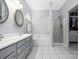 Bright bathroom with a double vanity, large tub, and separate walk-in shower at 14218 Springsure Ct, Huntersville, NC 28078