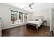 Bright bedroom with large windows offering natural light and views of the outdoor patio and pool at 14218 Springsure Ct, Huntersville, NC 28078