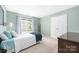 Cozy bedroom featuring soothing colors, natural light and double door closet at 14218 Springsure Ct, Huntersville, NC 28078