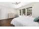 Airy bedroom featuring hardwood floors, natural lighting and overlooking the backyard patio at 14218 Springsure Ct, Huntersville, NC 28078