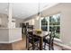 Dining area filled with natural light from the large window overlooking the outdoors at 14218 Springsure Ct, Huntersville, NC 28078