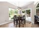 Comfortable dining space with large windows providing views of the outdoor patio at 14218 Springsure Ct, Huntersville, NC 28078