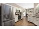 Well-appointed kitchen features stainless steel appliances and an adjacent dining area at 14218 Springsure Ct, Huntersville, NC 28078