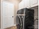 Convenient laundry room featuring modern appliances and ample storage space at 14218 Springsure Ct, Huntersville, NC 28078