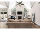 Bright living room with vaulted ceilings, a fireplace, and hardwood floors at 14218 Springsure Ct, Huntersville, NC 28078