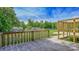 Wood deck overlooking a spacious, green backyard with mature trees at 1435 W Ridge Rd, Salisbury, NC 28147