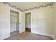 Bedroom featuring rainbow wallpaper accents and a closet at 1435 W Ridge Rd, Salisbury, NC 28147