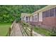 Close up of wood ramp to the front door, brick foundation and concrete walkway at 1435 W Ridge Rd, Salisbury, NC 28147