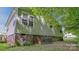 A shot of the back of the house showing siding and some of the yard at 1435 W Ridge Rd, Salisbury, NC 28147