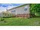 Exterior view of the home with a brick foundation and green lawn at 1435 W Ridge Rd, Salisbury, NC 28147