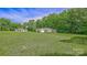 View of home from large grassy lawn, showing home and detached garage at 1435 W Ridge Rd, Salisbury, NC 28147