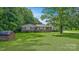 Ranch style home with a well-manicured front yard and concrete driveway at 1435 W Ridge Rd, Salisbury, NC 28147