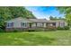 Ranch style home with brick foundation, wood ramp, shutters and a well-manicured lawn at 1435 W Ridge Rd, Salisbury, NC 28147