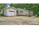 Exterior side view of home featuring garage with long driveway at 1435 W Ridge Rd, Salisbury, NC 28147