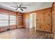 Living room with hardwood floors, wood paneled walls and built in shelves at 1435 W Ridge Rd, Salisbury, NC 28147