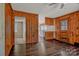 Living room featuring wood paneled walls, hardwood floors, and doorways to other rooms at 1435 W Ridge Rd, Salisbury, NC 28147