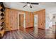 Open concept living room with hardwood floors, wood paneled walls and doorways to other rooms at 1435 W Ridge Rd, Salisbury, NC 28147