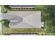 Aerial view of a well-maintained home with a cozy back patio, lush landscaping, and a neatly manicured lawn at 14531 Crosswater Ln, Charlotte, NC 28278